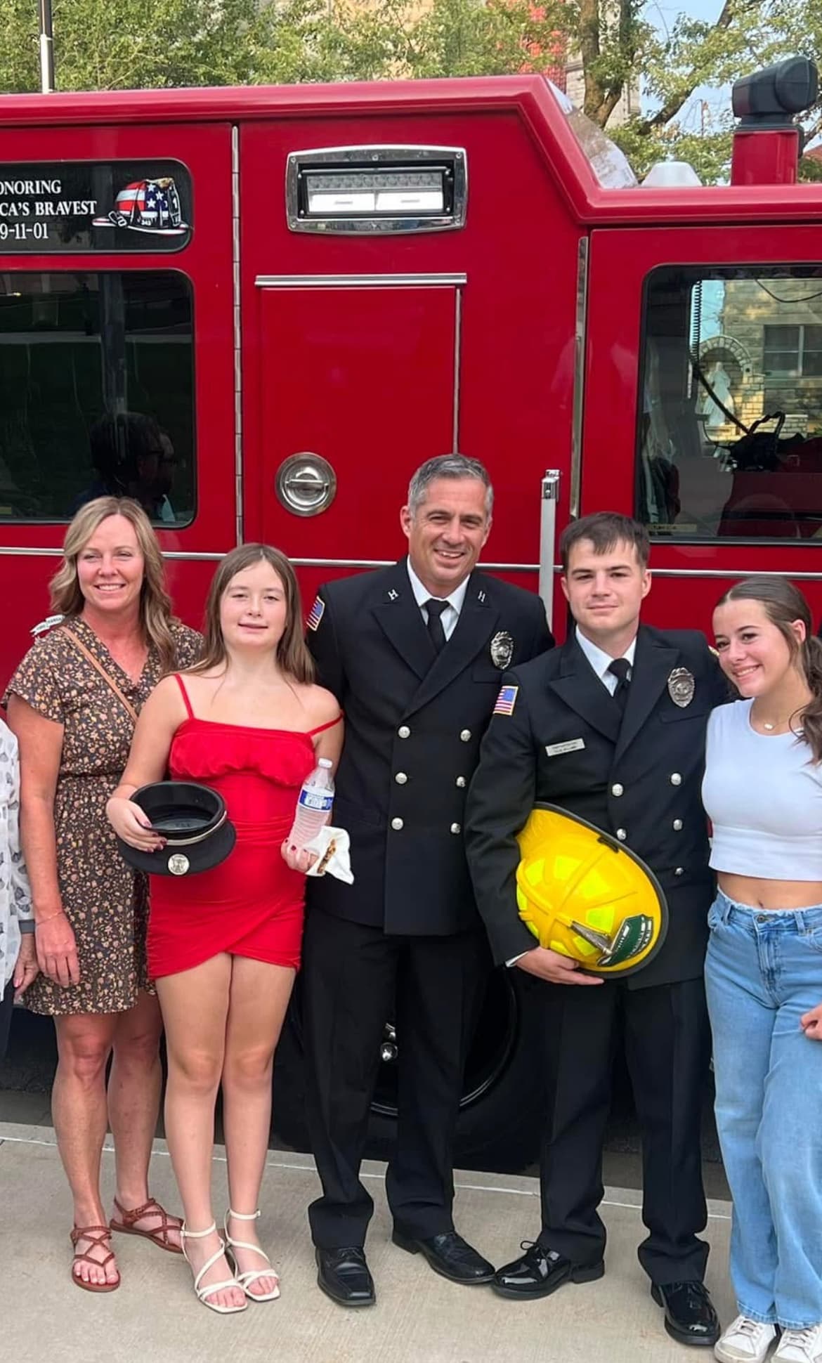 Captain Brian Williams in KCKFD dress uniform with his wife, daughters, and son (also KCKFD) at his son's fire academy graduation